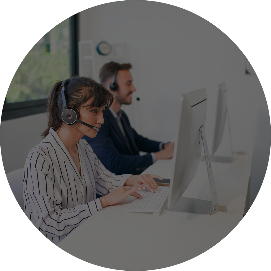 black hills ai customer support working on computer with headsets