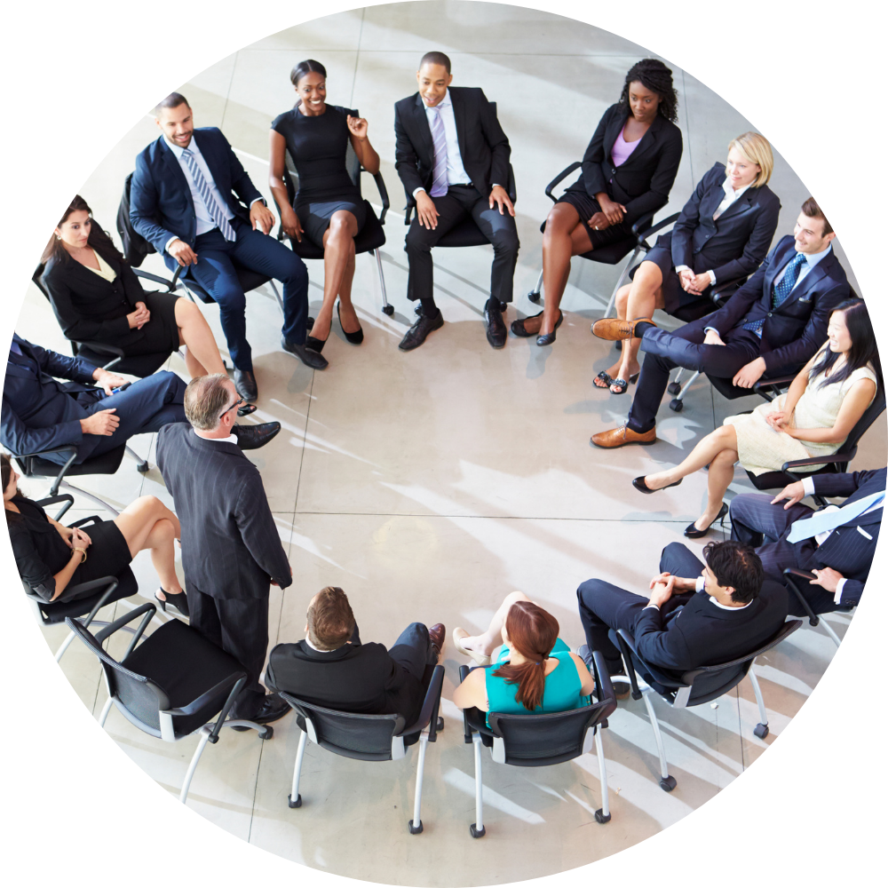 business employees working for a large corporation sitting in a circle
