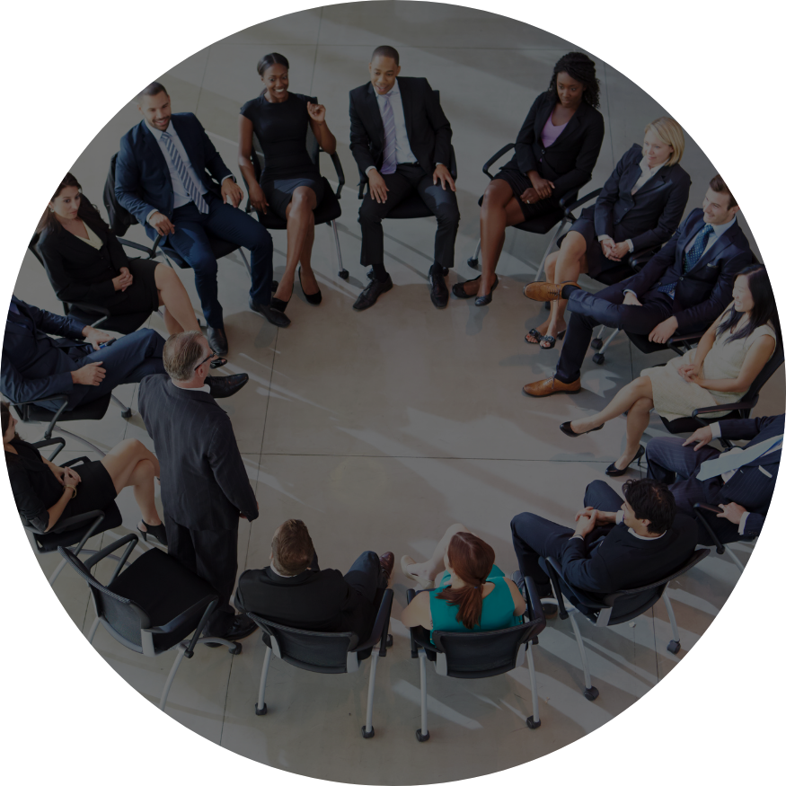 large corporation of employees sitting in big circle