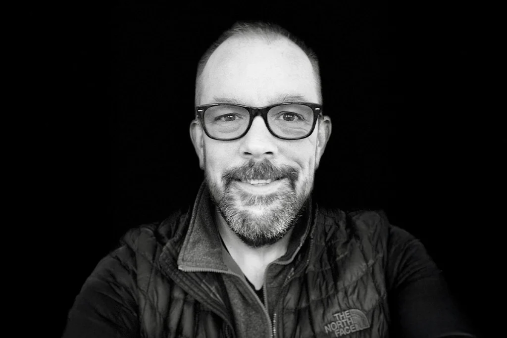 Portrait of Jim Hallenbeck who is the founder & CEO of Black Hills AI who uses his decades of experience as a IP attorney to bring valuable services & tools to the IP industry.