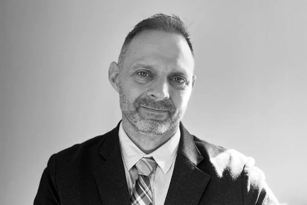 Portrait image of Thomas Marlow who is the CTO of Black Hills AI & IP renewals president who is also a registered patent attorney & electrical engineer.